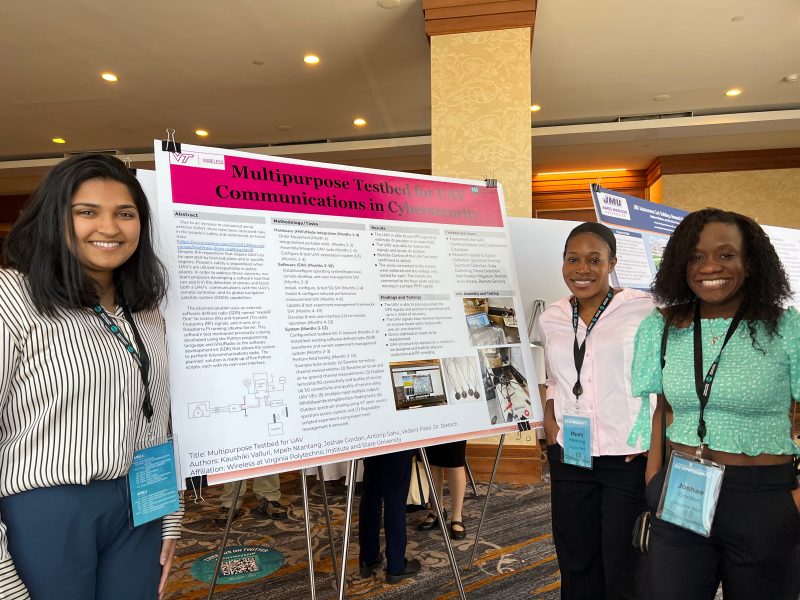 3 students in front of a research poster at the 2022 CCI Symposium