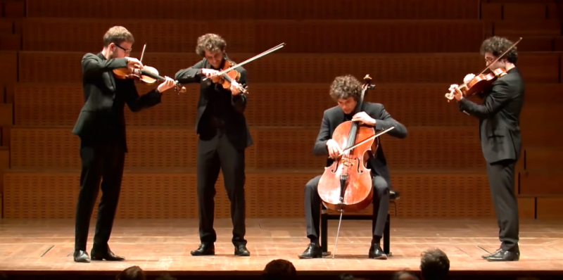 Concert, 4 artists playing on stage.