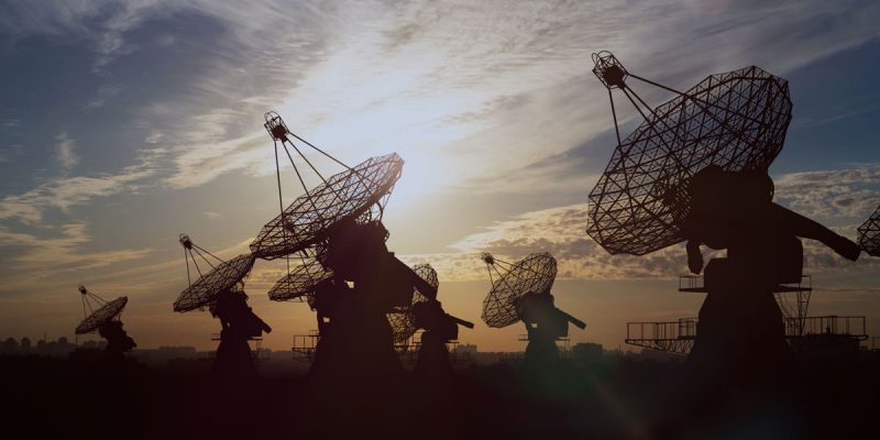 Satellite dishes pointing at sky