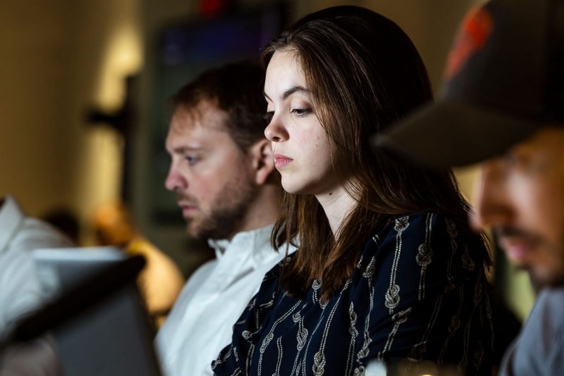 Carly Wolfe of Virginia Tech and Andrew Franck of Regent University at CACI Con. College students work on computers