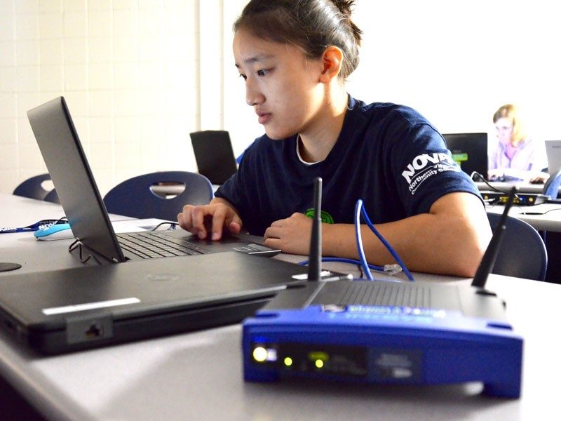 A student works on a computer in NOVA's stem program