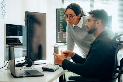 cybersecurity professionals work on computers