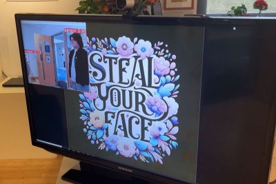 TV screen with Steal Your Face and Smaller Image of a person