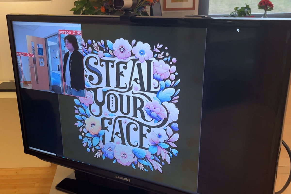 Screen with steal your face and image of person