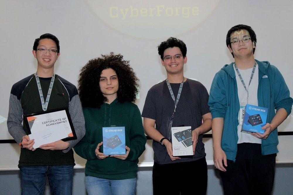 Four students hold prizes