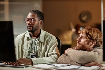 Instructor works on computer while student watchs