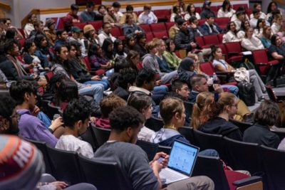 Auditorium filled with students with laptops