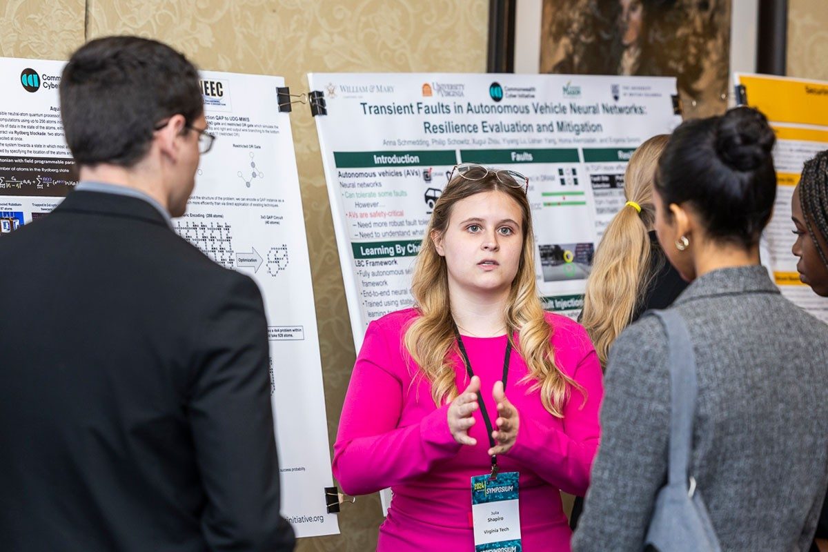 Student discusses research with other students