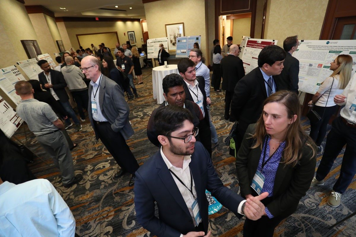 2023 CCI Symposium participants gather in the poster presentation area of the event at the Omni Richmond 