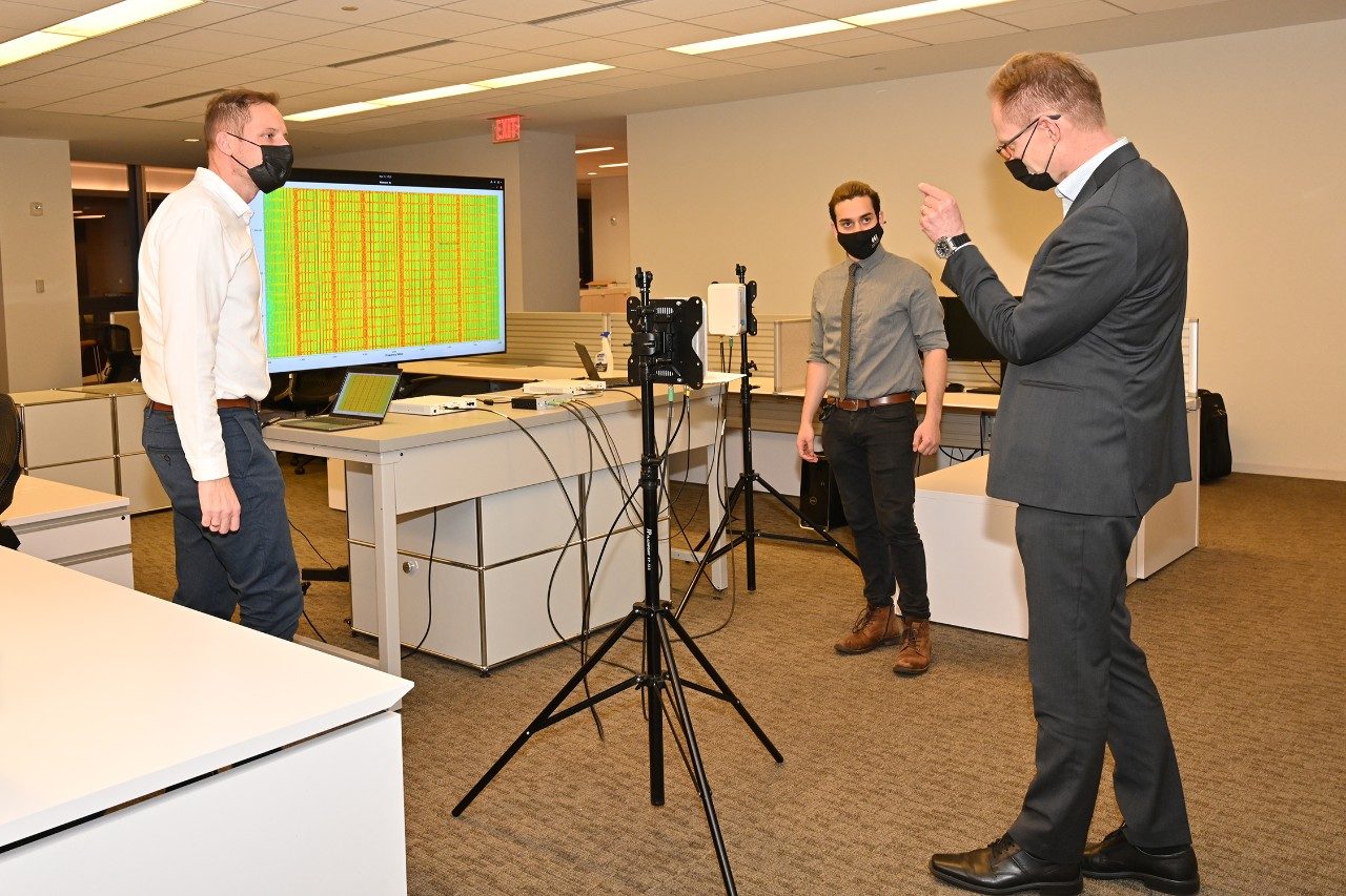 CCI Researchers Jacek Kibilda (left) and Joao Santos (right) discuss CCI's work in 5G with Finland’s Minister of Economic Affairs Mika Lintilä, his delegation from the Ministry of Economic Affairs, the Ambassador of Finland to the U.S. Mikko Hautala, and Embassy officials. The mmWave Radio Units used in the demonstration are part of a collaboration project with Interdigital Communications, Inc. under the agreement (AT-81987). Photos by Hilary Schwab for CCI.
