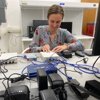 CCI researcher Samantha Parry Kenyon, works with digital equipment in a lab.