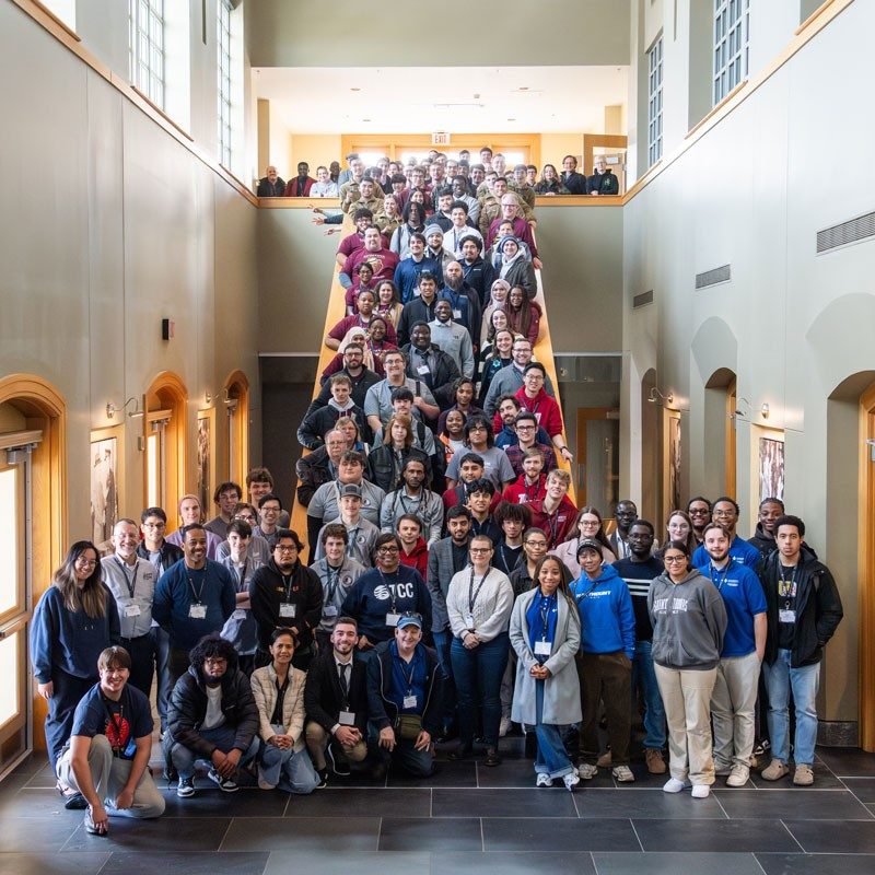 Large group standing on staircase