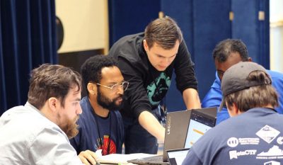 Students study data on computer screens at Cyberforge at Christopher Newport University