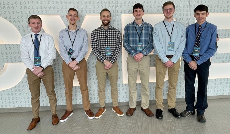 Six members of Liberty University cybersecurity team in a row