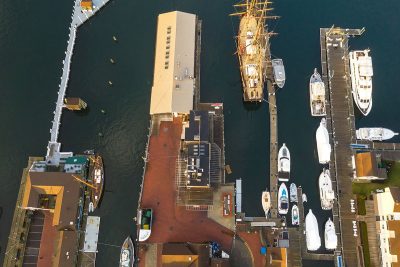 drone view of marina filled with ships