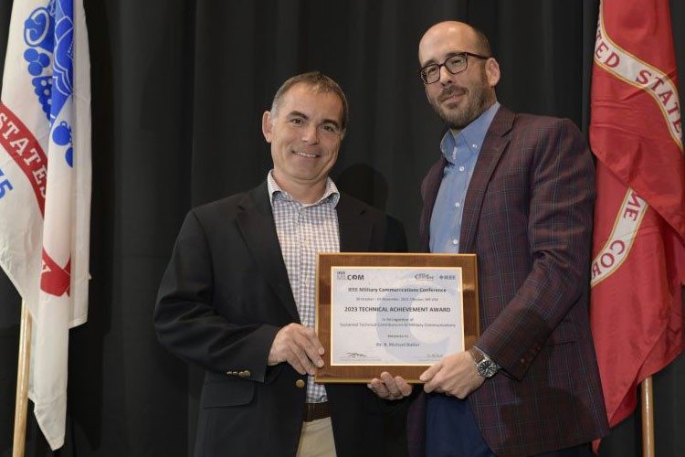 one man presents another with an award