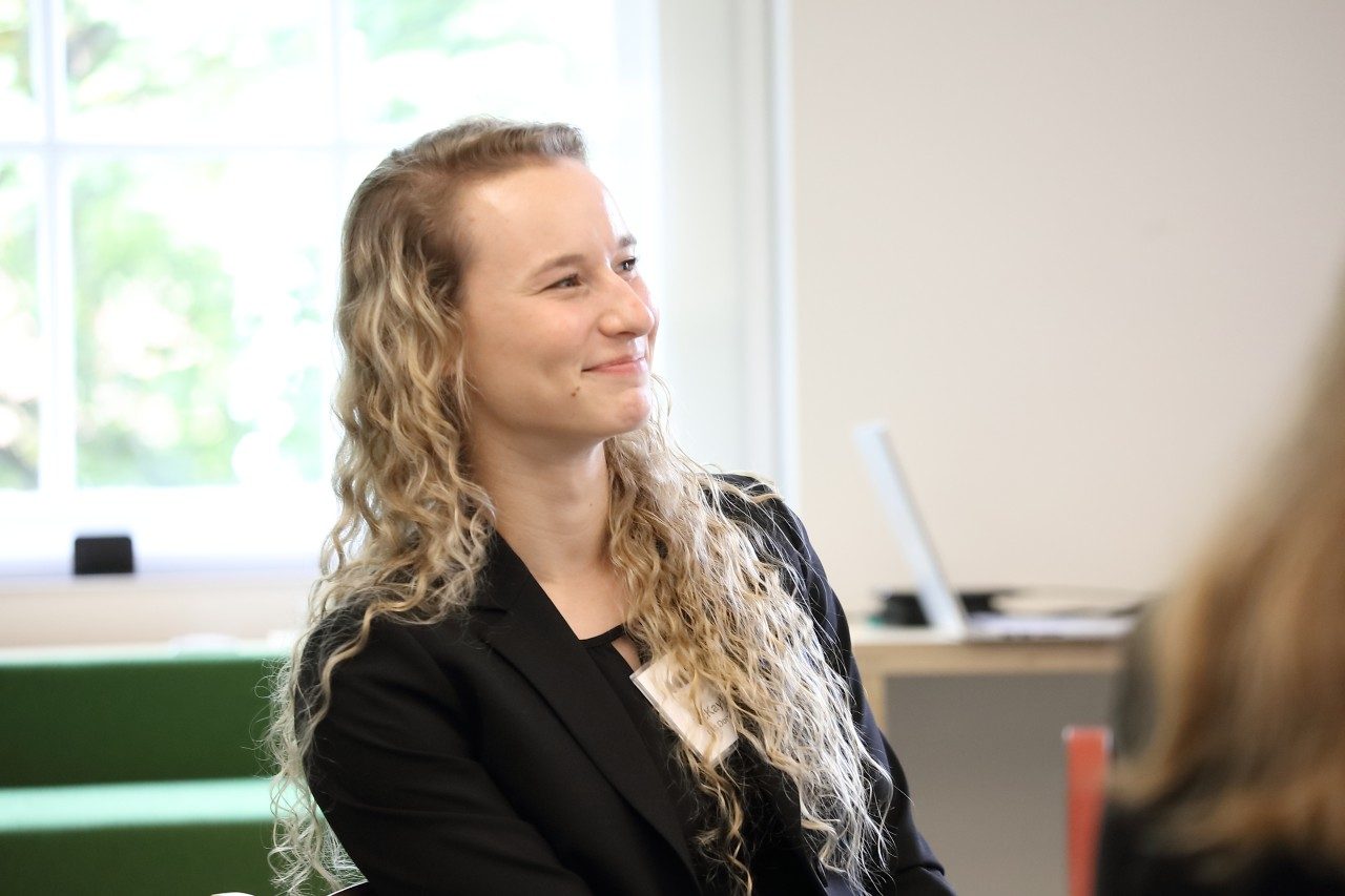 Old Dominion University graduate student McKayla Hagerty, who is part of a CCI-funded research project, listens to presentations about mis/disinformation. Photo by Tom Cogill for Commonwealth Cyber Initiative. 