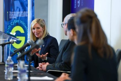 People talking in front of microphones 