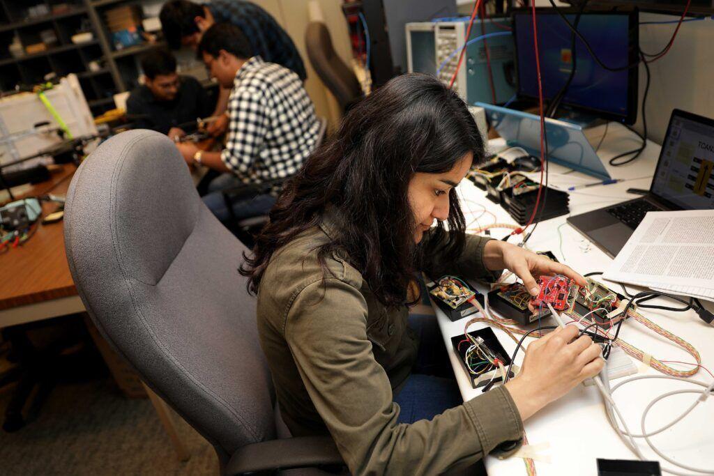 Students work on electronic gear