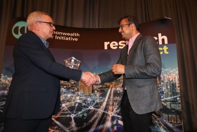 Luiz DaSilva presents Irfan Ahmed with award