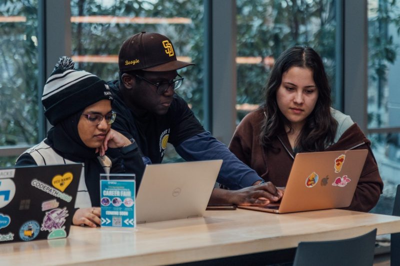 Students study laptops
