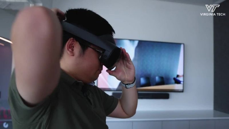 graduate student putting on Meta head mounted display device